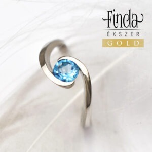 Ölelés fehér arany gyűrű kék topázzal